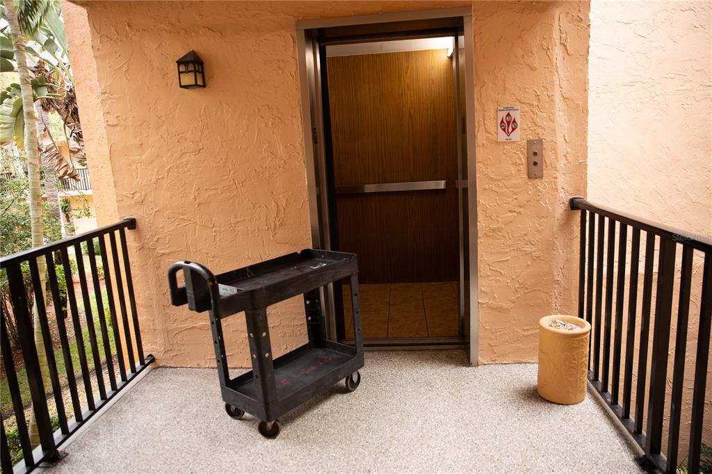 8911 Blind Pass Road, Unit 220 St. Pete Beach, FL 33706 - Photo 64 of 67 a view of a porch with a door and a gate