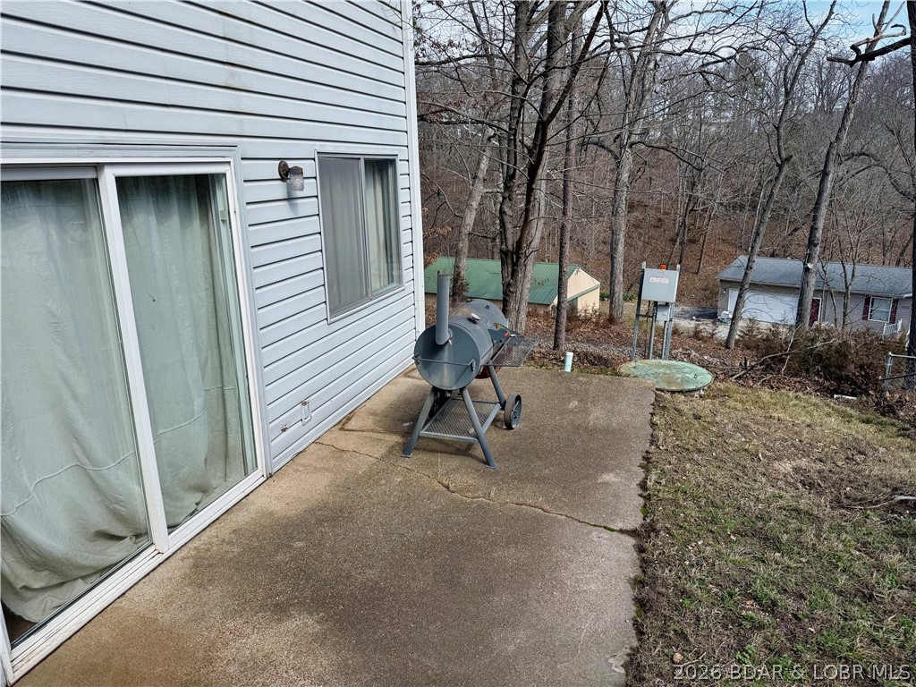 876 Malibu Road Osage Beach, MO 65065 - Photo 33 of 37 Exterior slider door that enters into the primary