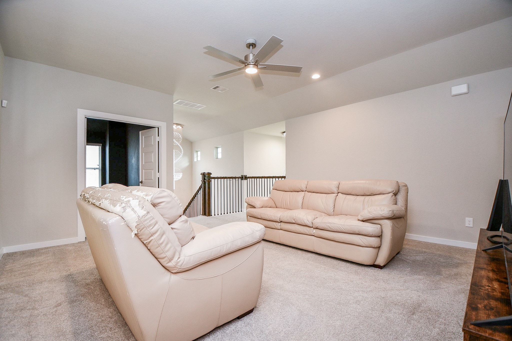 3430 Majestic Pine Lane Rosenberg, TX 77471 - Photo 18 of 32 a living room with furniture and a ceiling fan