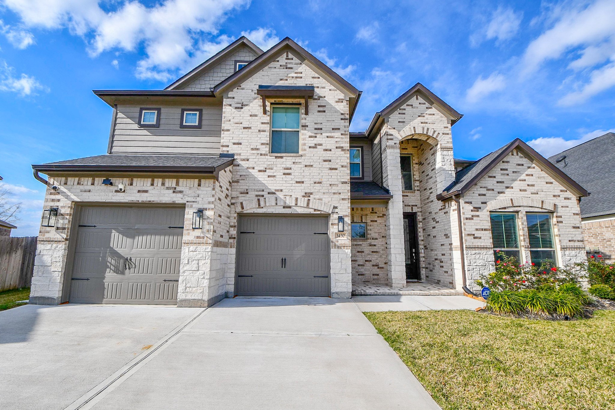 3430 Majestic Pine Lane Rosenberg, TX 77471 - Photo 2 of 32 a front view of a house with garden