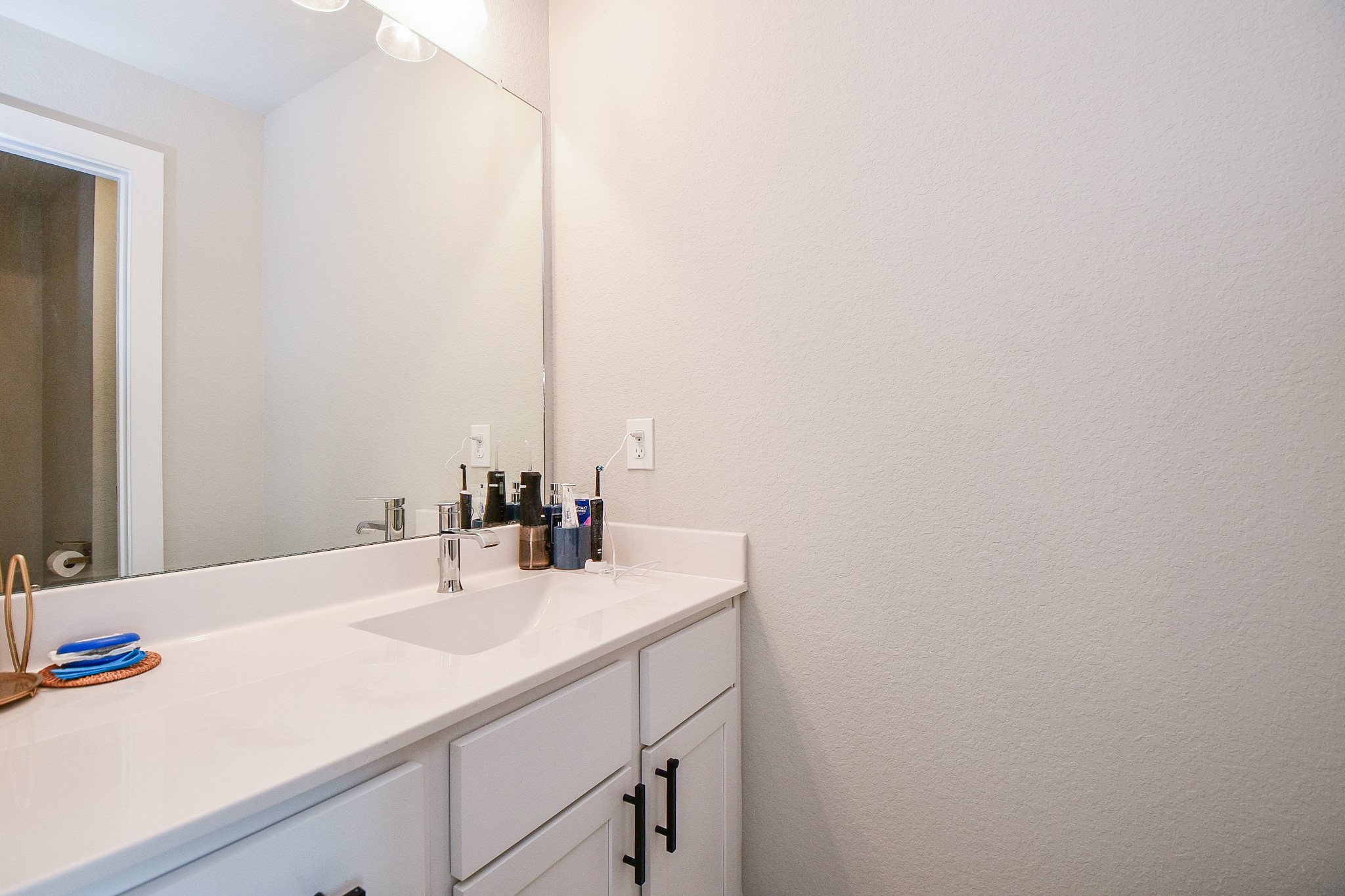 3430 Majestic Pine Lane Rosenberg, TX 77471 - Photo 26 of 32 a bathroom with a sink and a mirror