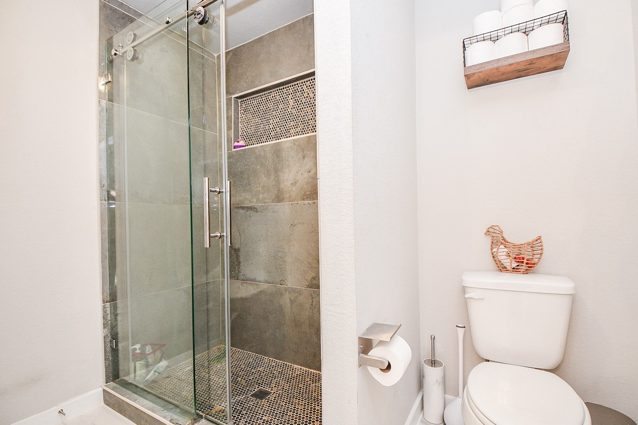 3430 Majestic Pine Lane Rosenberg, TX 77471 - Photo 27 of 32 a bathroom with a toilet and a shower