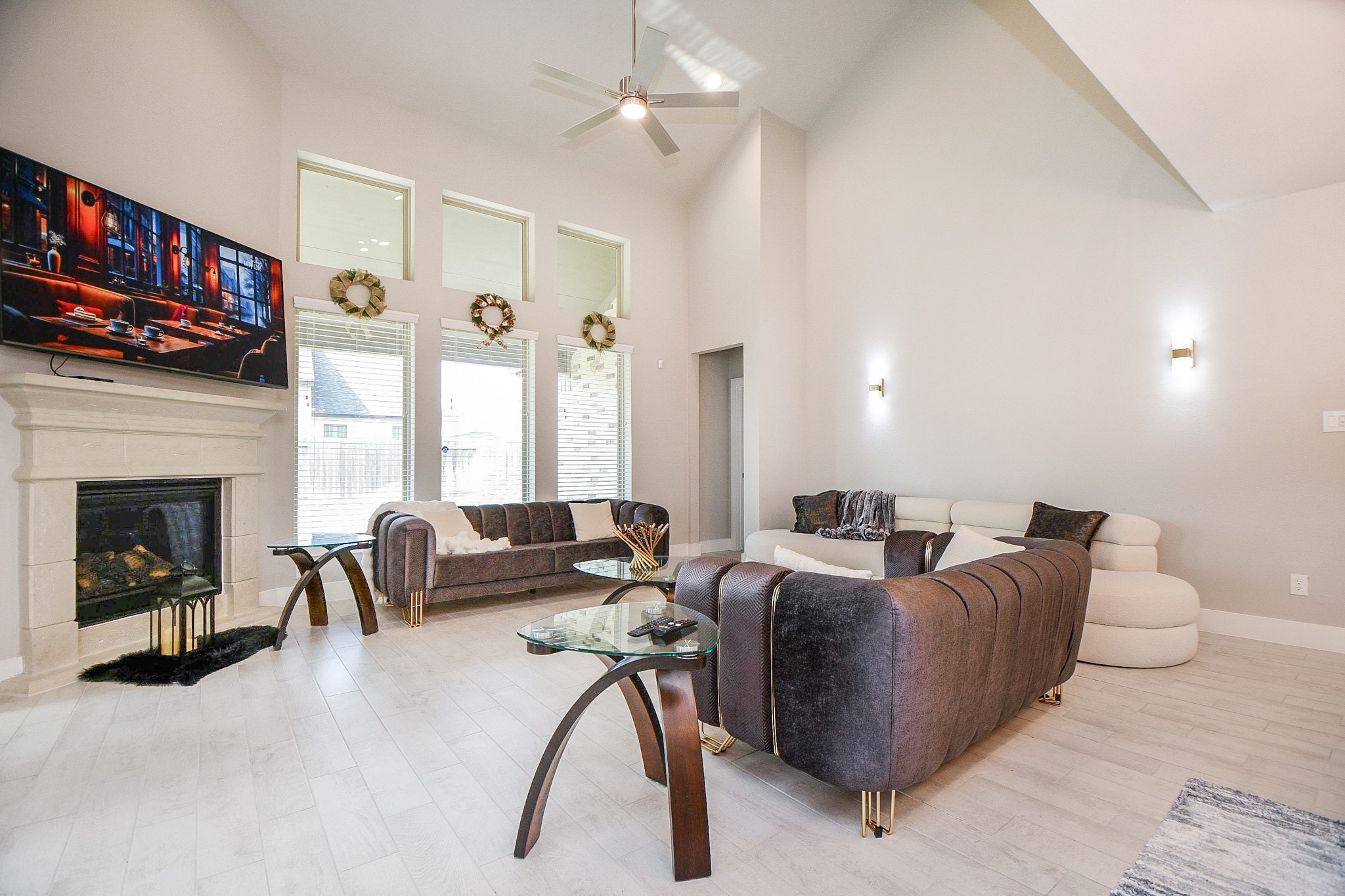 3430 Majestic Pine Lane Rosenberg, TX 77471 - Photo 3 of 32 a living room with furniture a fireplace and a flat screen tv