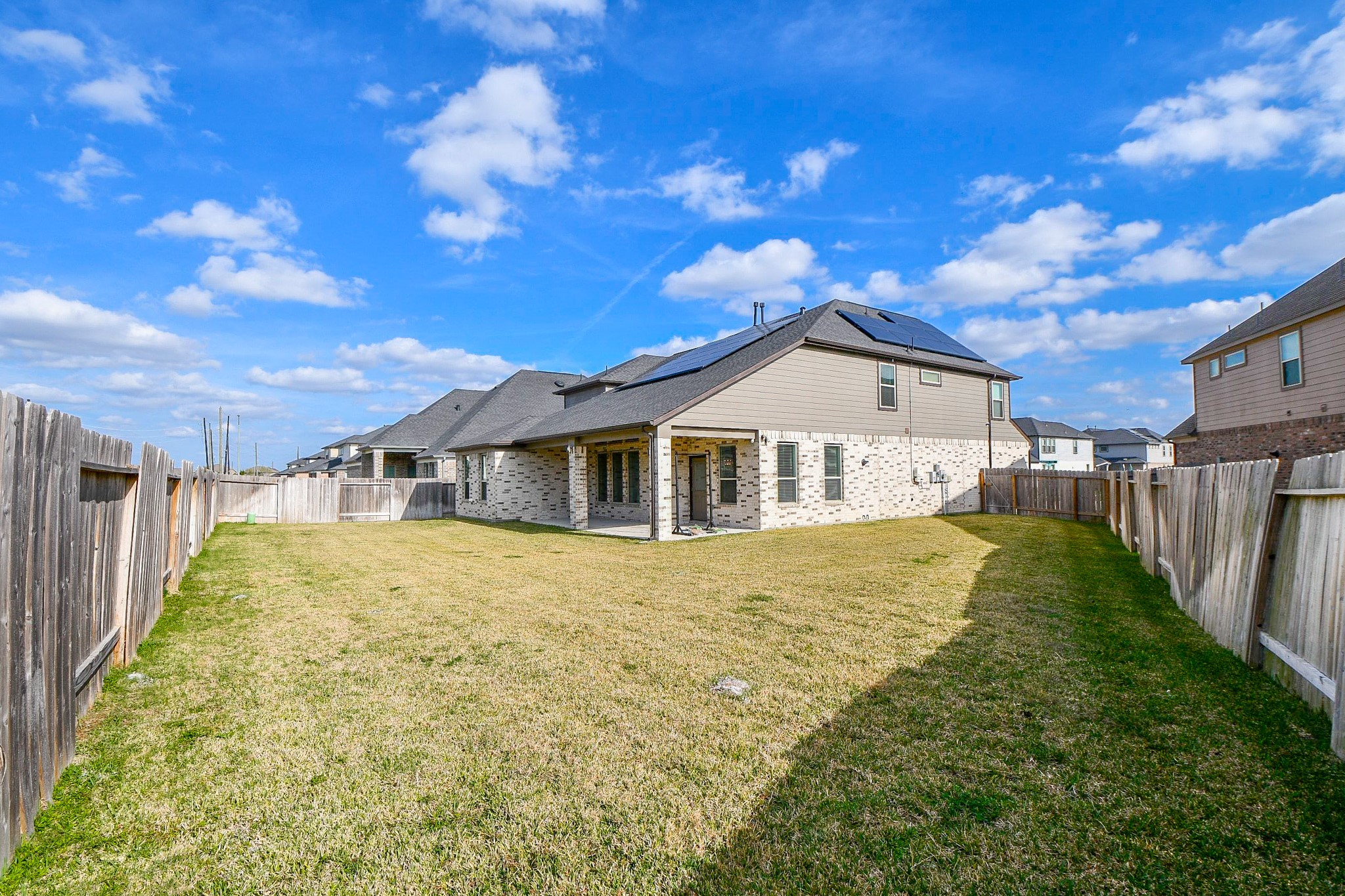 3430 Majestic Pine Lane Rosenberg, TX 77471 - Photo 32 of 32 a front view of a house with a yard