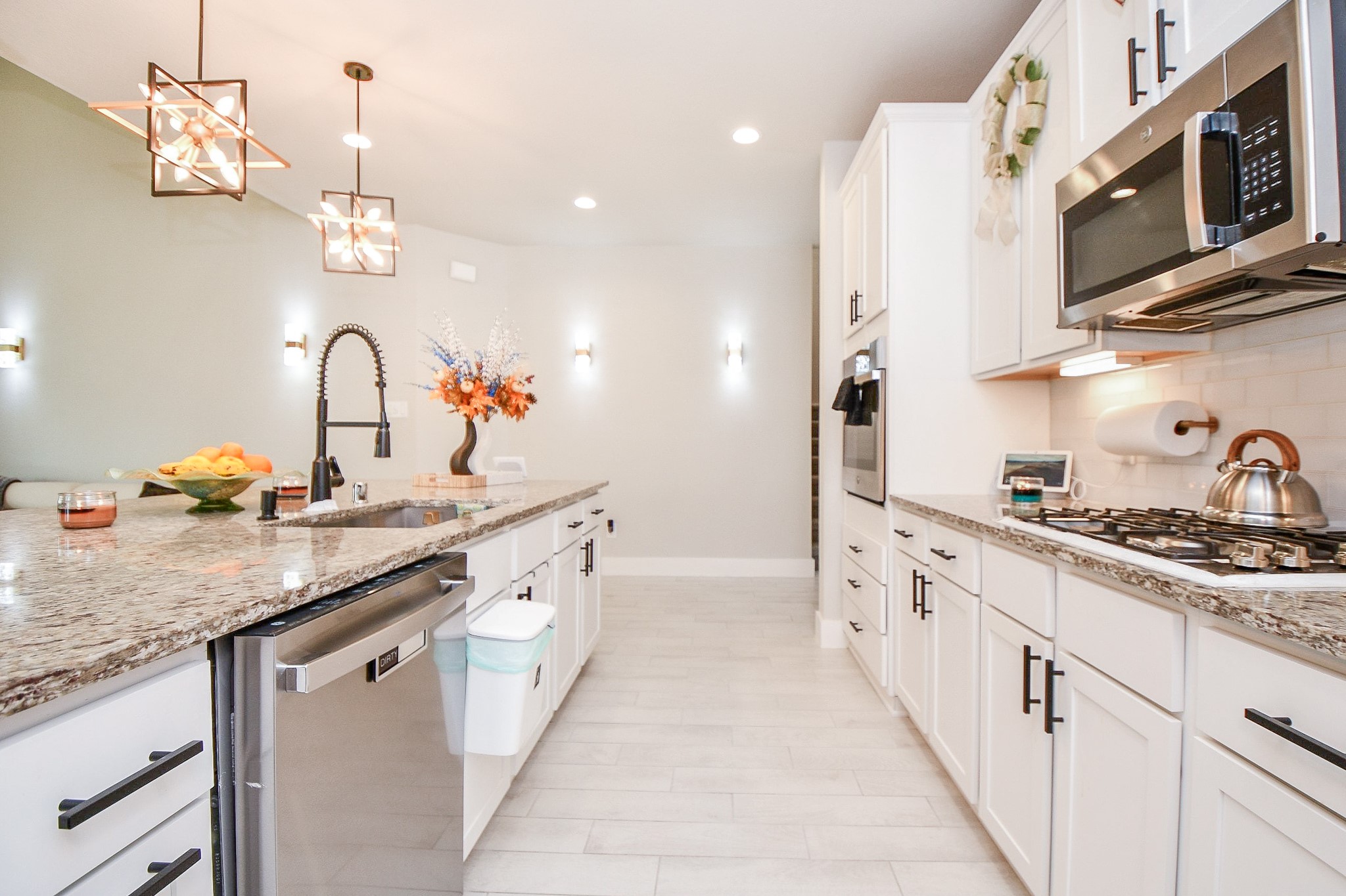 3430 Majestic Pine Lane Rosenberg, TX 77471 - Photo 8 of 32 a kitchen with stainless steel appliances granite countertop a sink and cabinets