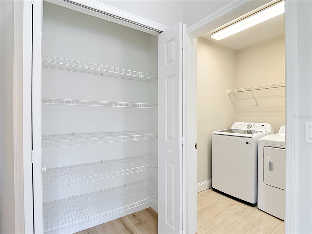 5310 Anhinga Trail New Port Richey, FL 34653 - Photo 22 of 27 a view of storage and utility room with washer and dryer
