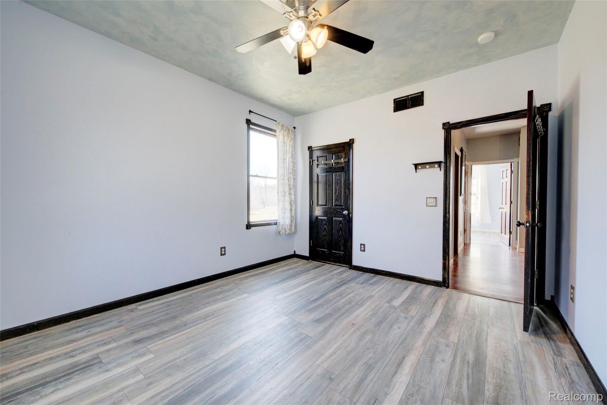 1888 North Briggsville Road Fowlerville, MI 48836 - Photo 28 of 44 Back bedroom view toward hall.jpg
