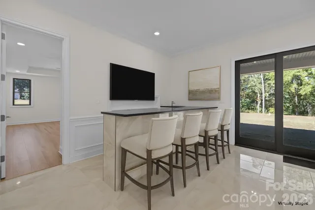 a bathroom with a granite countertop sink a mirror a shower and a bathtub
