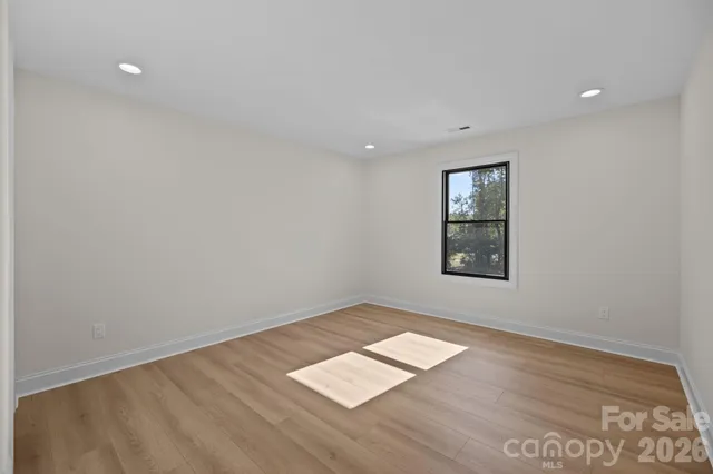 an aerial view of a house with a lake view