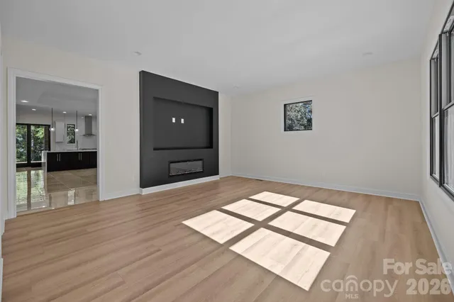 a kitchen with granite countertop a sink stove and cabinets
