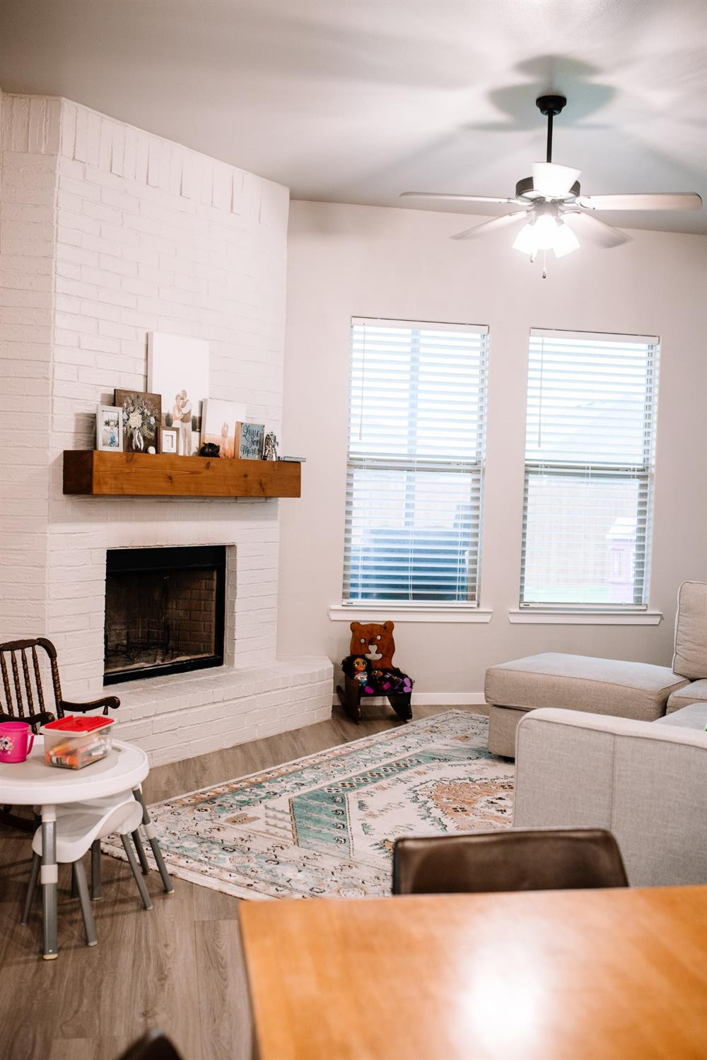 3224 Virginia Avenue Lubbock, TX 79407 - Photo 11 of 39 a living room with furniture and a fireplace