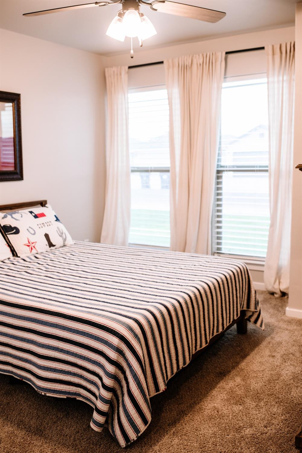 3224 Virginia Avenue Lubbock, TX 79407 - Photo 20 of 39 a bedroom with a bed and a window