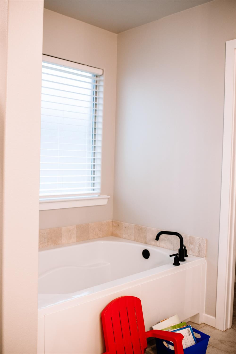 3224 Virginia Avenue Lubbock, TX 79407 - Photo 27 of 39 a bathroom with a bathtub and a window