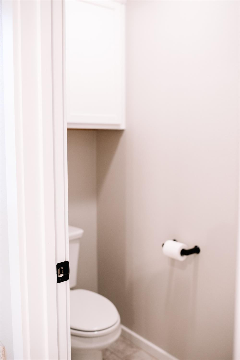 3224 Virginia Avenue Lubbock, TX 79407 - Photo 29 of 39 a white toilet sitting next to a white sink