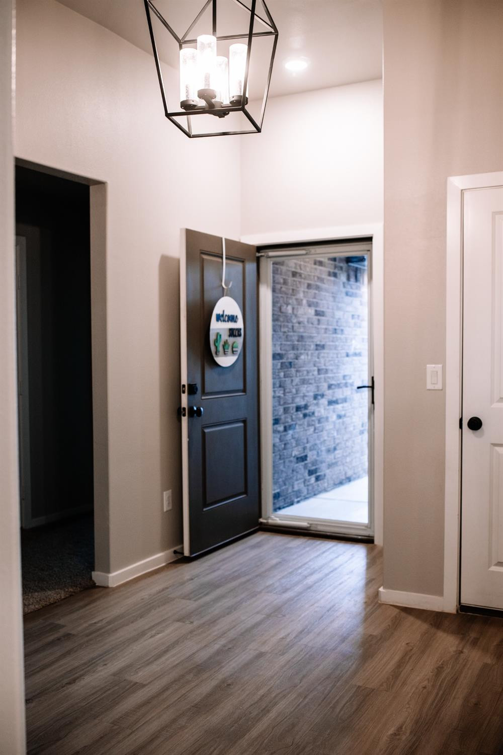 3224 Virginia Avenue Lubbock, TX 79407 - Photo 3 of 39 a view of a hallway with wooden floor