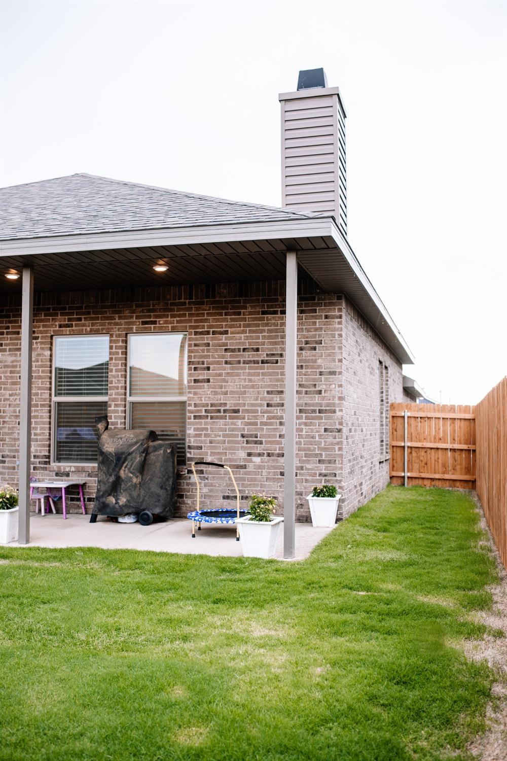 3224 Virginia Avenue Lubbock, TX 79407 - Photo 35 of 39 a backyard of a house with table and chairs