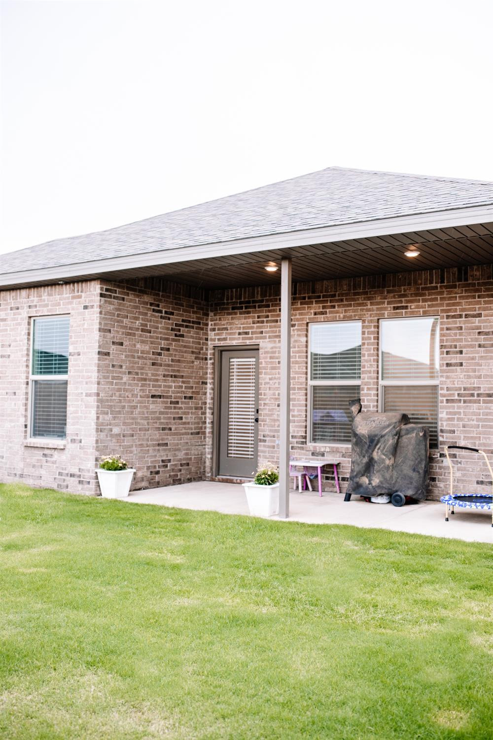 3224 Virginia Avenue Lubbock, TX 79407 - Photo 36 of 39 a backyard of a house with table and chairs