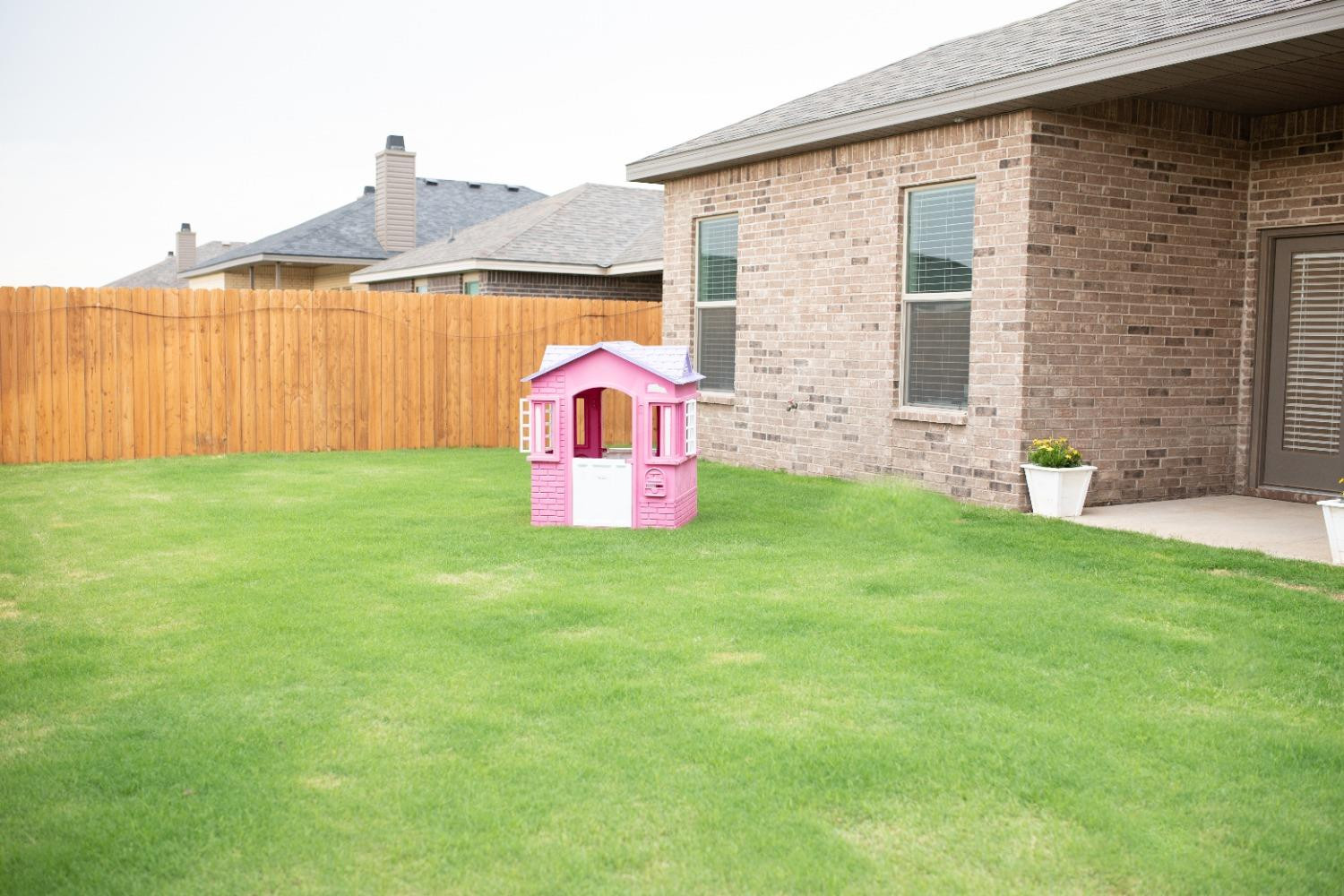 3224 Virginia Avenue Lubbock, TX 79407 - Photo 37 of 39 a front view of a house with garden