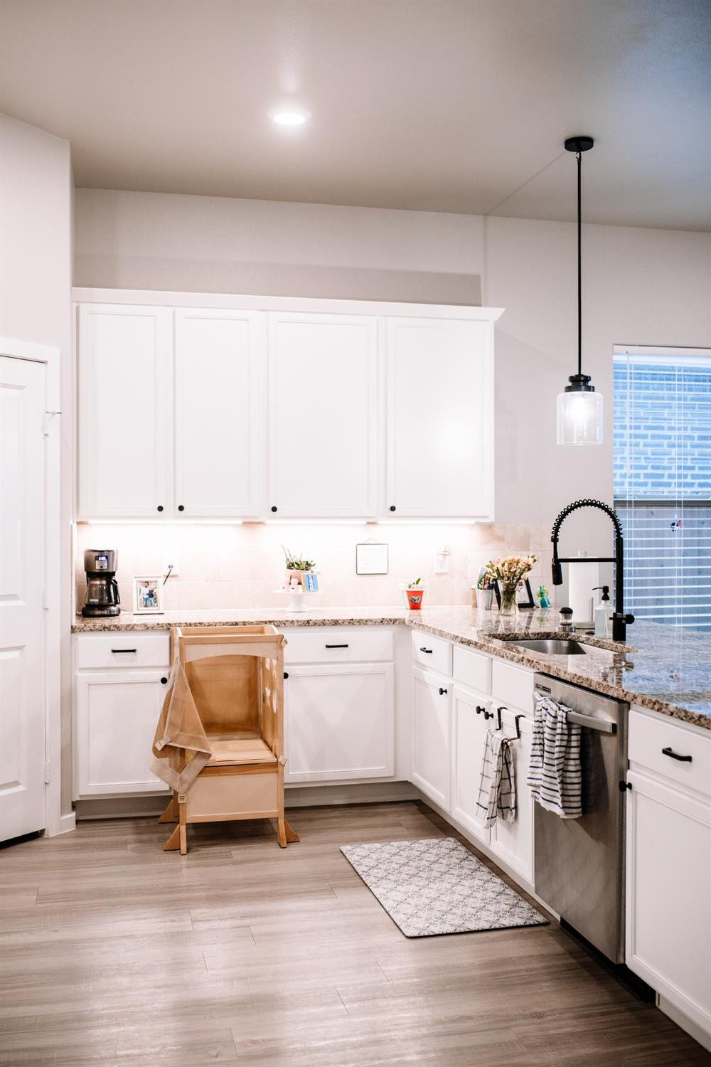 3224 Virginia Avenue Lubbock, TX 79407 - Photo 5 of 39 a kitchen with a sink cabinets and wooden floor