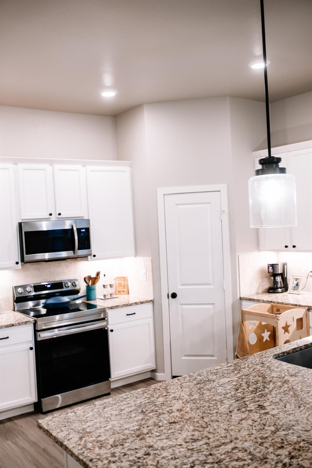 3224 Virginia Avenue Lubbock, TX 79407 - Photo 8 of 39 a kitchen with granite countertop a stove and a sink