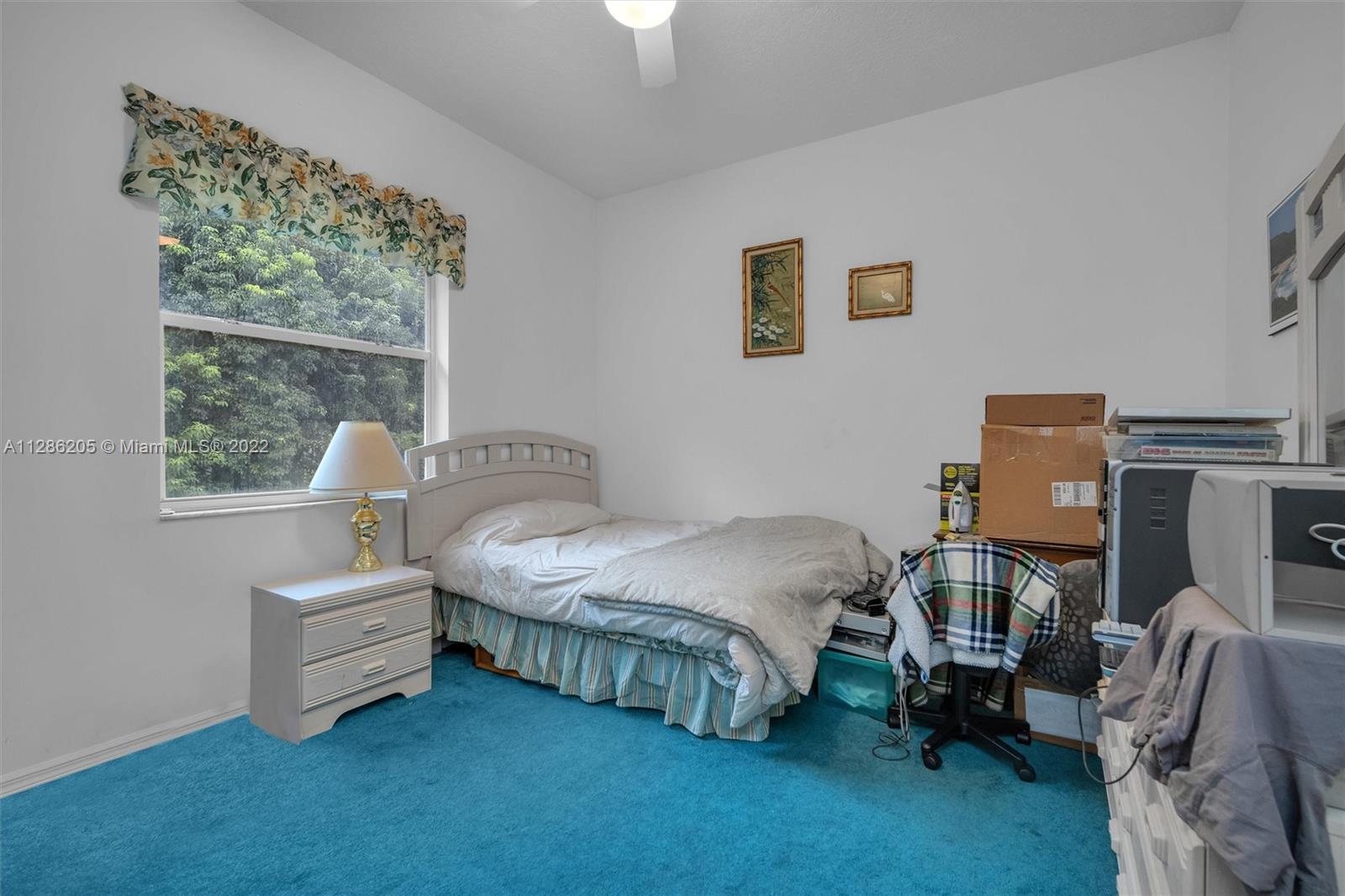 17880 Southwest 66th Street Southwest Ranches, FL 33331 - Photo 23 of 57 a spacious bedroom with a bed and a window
