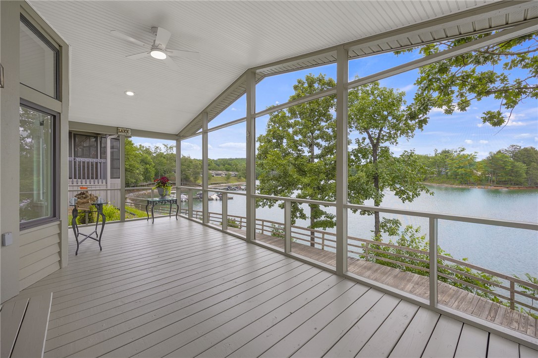 1230 Melton Road, Unit 30 West Union, SC 29696 - Photo 2 of 42 A spacious screened porch overlooks a tranquil lake, perfect for enjoying waterfront vistas.