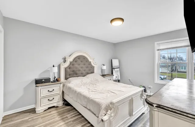 a bedroom with a bed and a cabinets