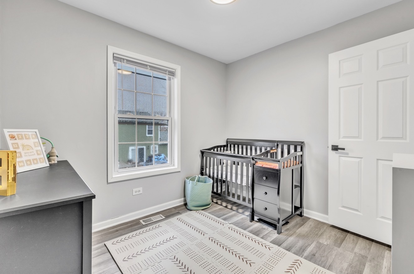 20538 South Frankfort Square Road Frankfort, IL 60423 - Photo 13 of 27 a view of a bedroom with a window and wooden floor