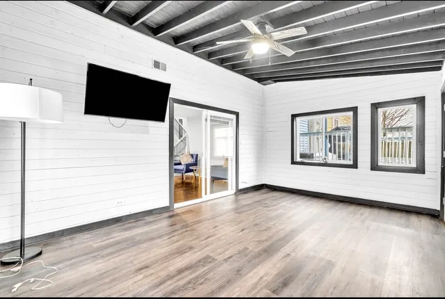 a house view with swimming pool in front of it