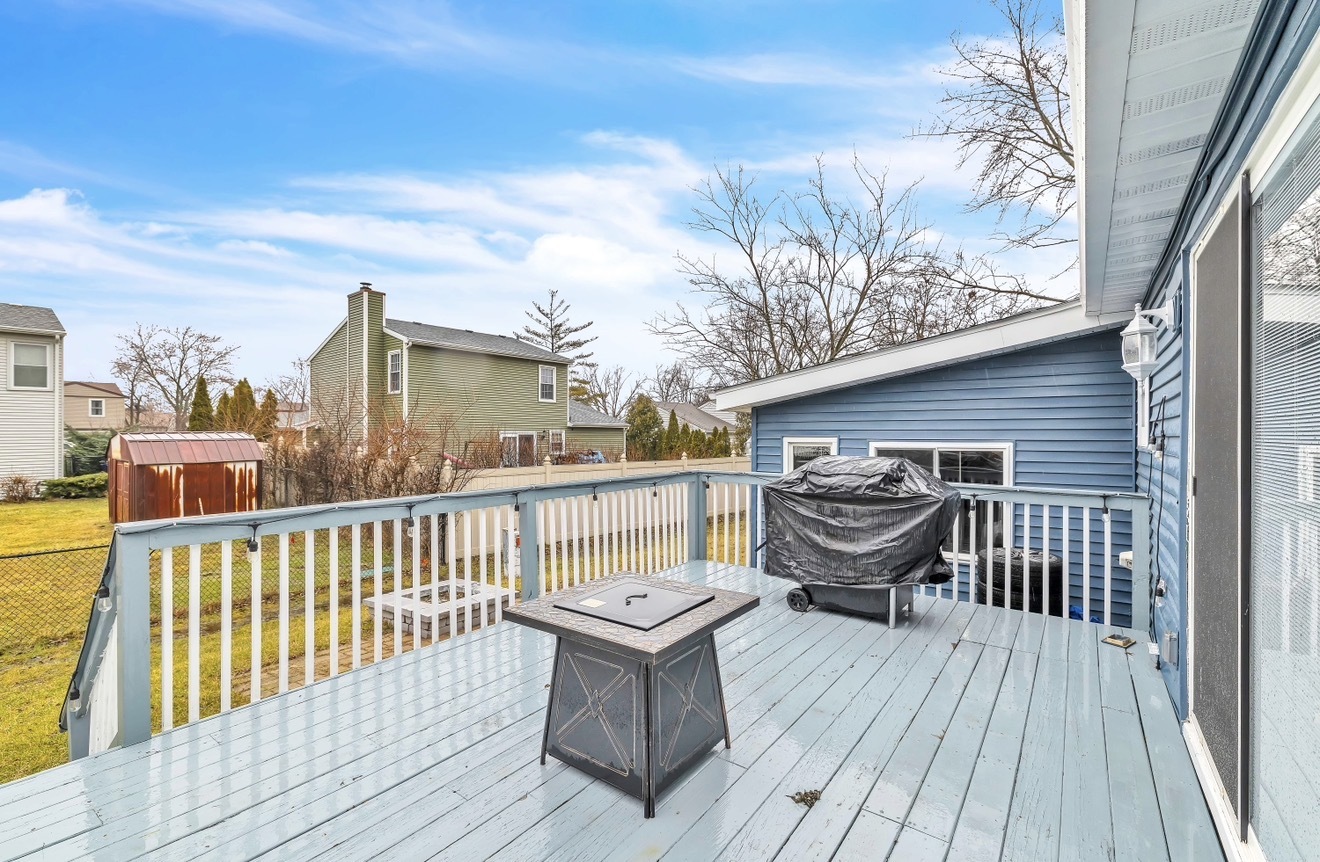 20538 South Frankfort Square Road Frankfort, IL 60423 - Photo 22 of 27 a view of a roof deck with table and chairs a barbeque with wooden floor and fence