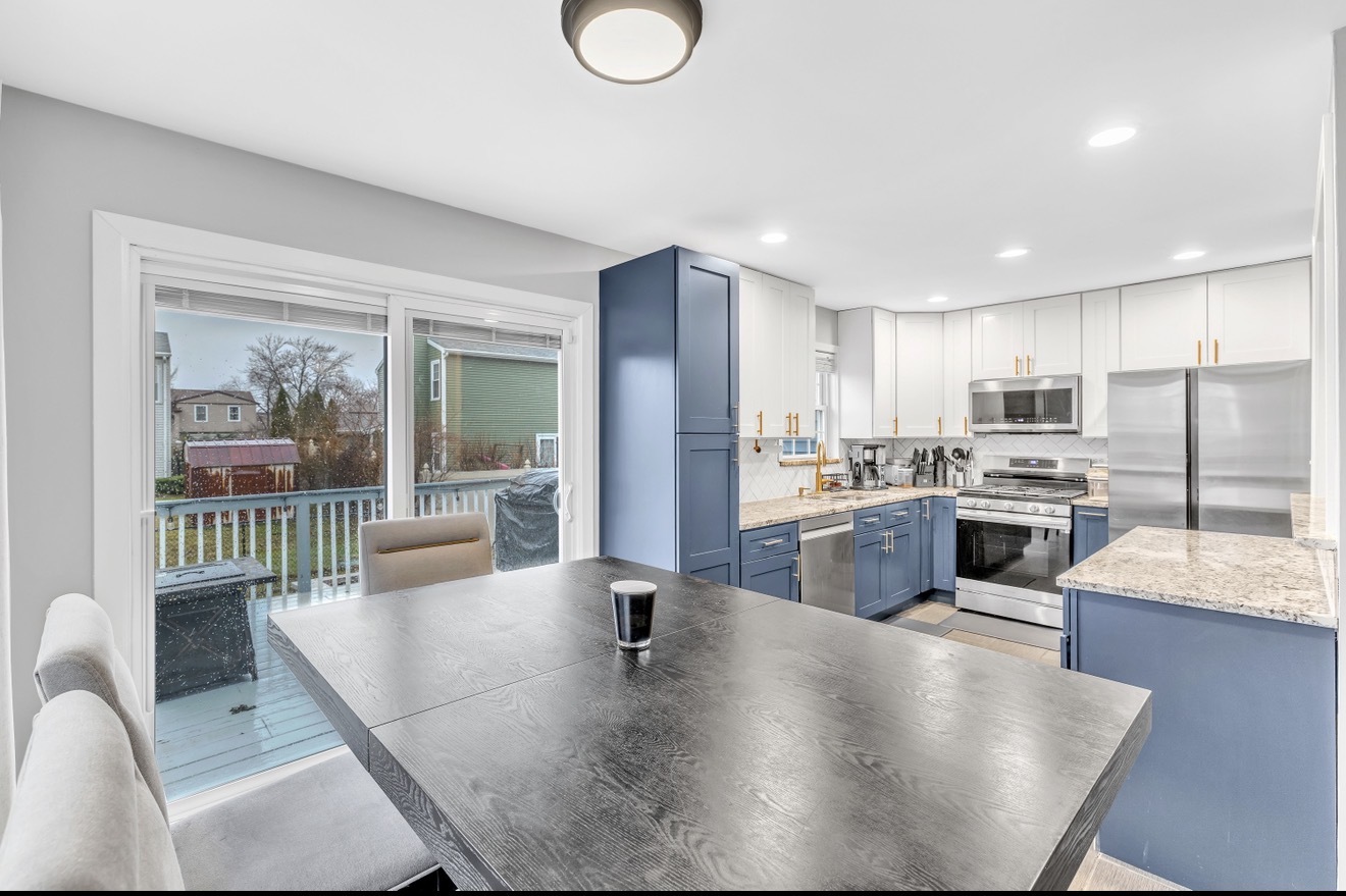20538 South Frankfort Square Road Frankfort, IL 60423 - Photo 6 of 27 a kitchen with stainless steel appliances granite countertop a stove a refrigerator a oven a sink a dining table and chairs with wooden floor