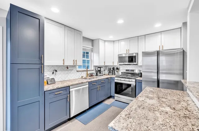 a kitchen with a refrigerator sink and microwave