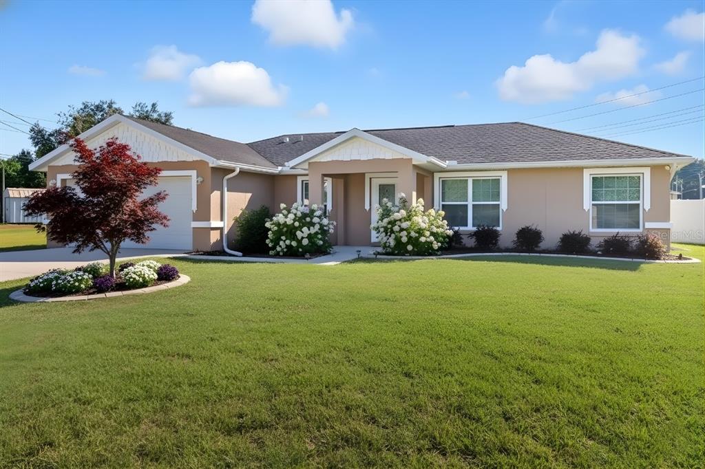 1 Pecan Course Circle Ocala, FL 34472 - Photo 2 of 24 a front view of a house with garden