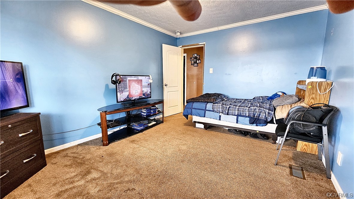 633 Taylors Mill Road Emporia, VA 23847 - Photo 11 of 14 a living room with furniture and a flat screen tv