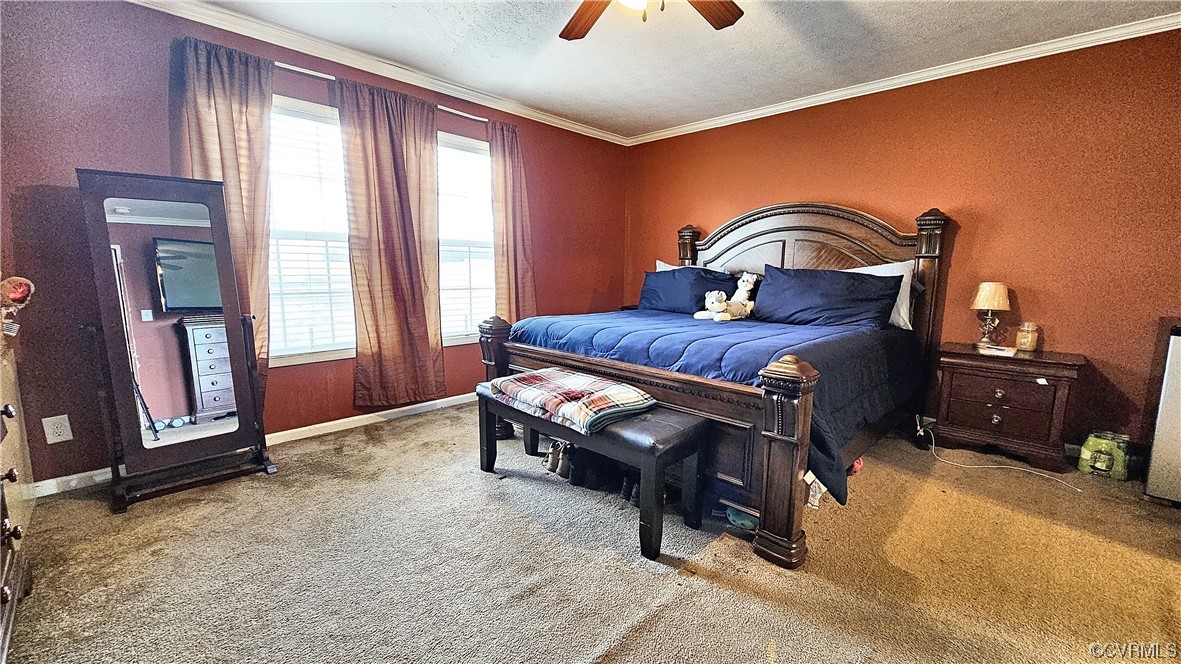 633 Taylors Mill Road Emporia, VA 23847 - Photo 12 of 14 a bedroom with a bed and wooden floor