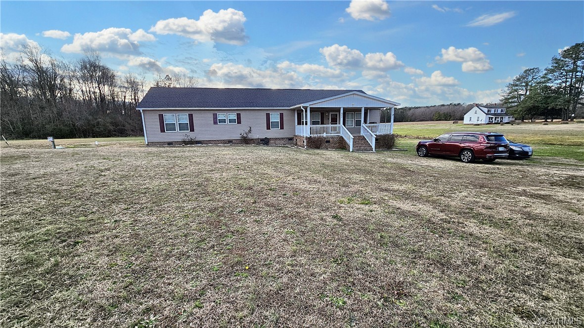633 Taylors Mill Road Emporia, VA 23847 - Photo 14 of 14 a view of a big house with a big yard and large trees