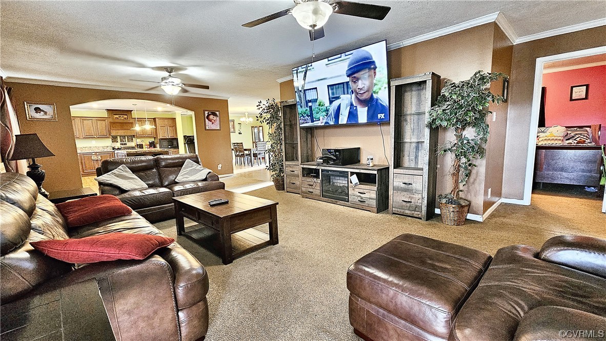 633 Taylors Mill Road Emporia, VA 23847 - Photo 2 of 14 a living room with furniture and a flat screen tv