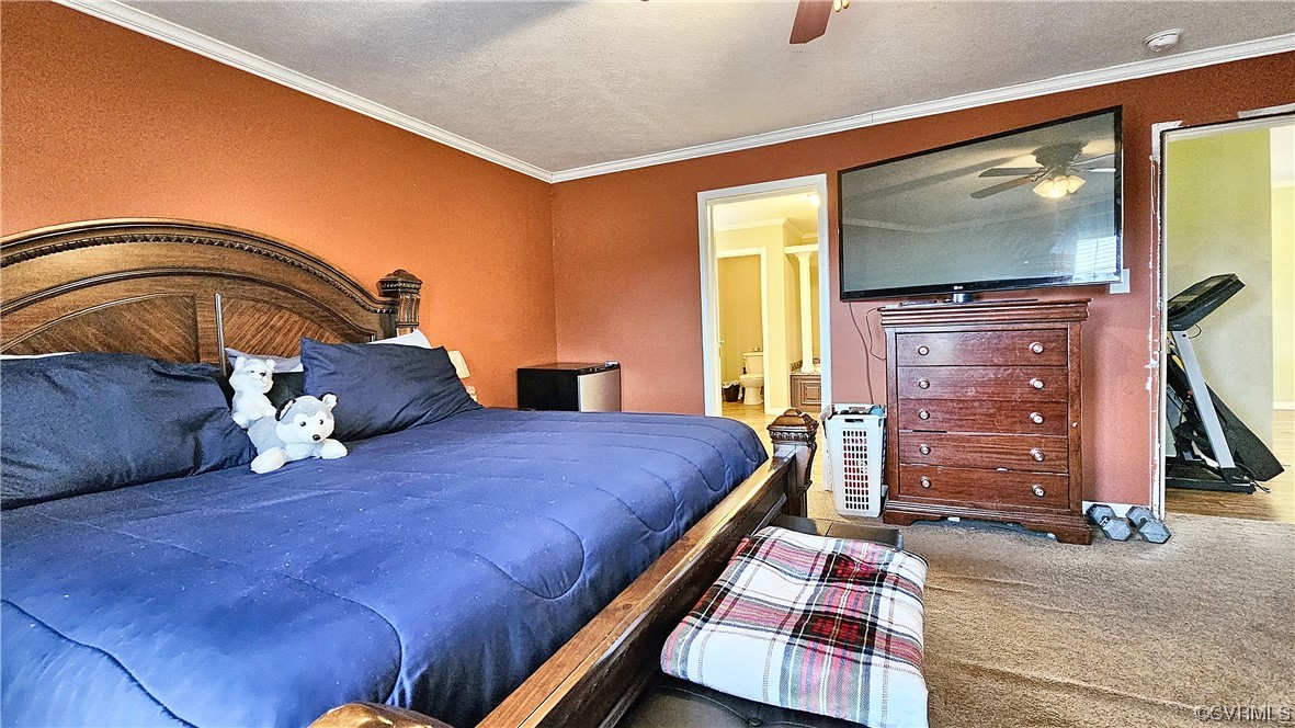 633 Taylors Mill Road Emporia, VA 23847 - Photo 5 of 14 a bedroom with a bed and a flat tv screen