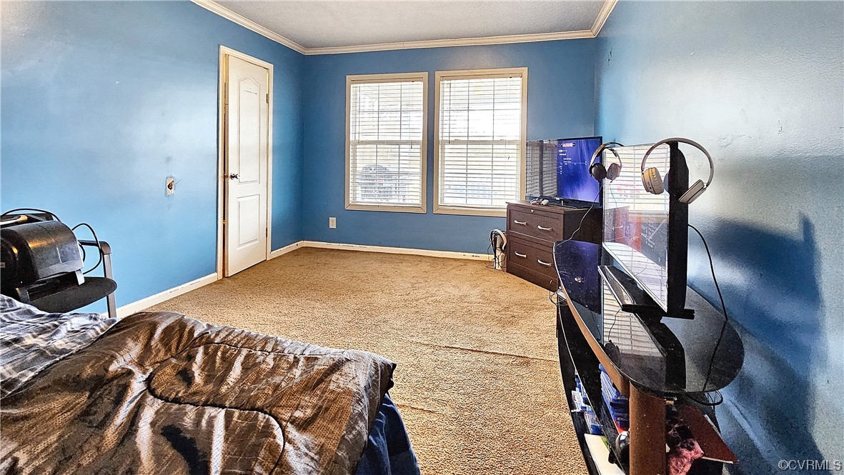 633 Taylors Mill Road Emporia, VA 23847 - Photo 8 of 14 a bedroom with a bed and dresser