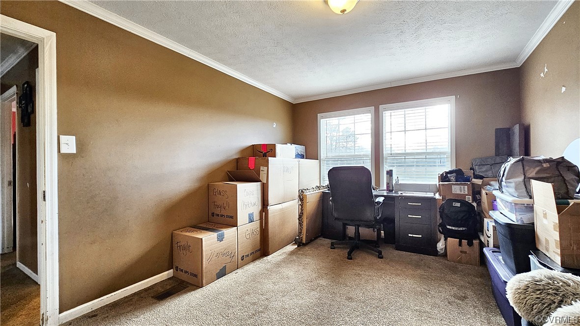 633 Taylors Mill Road Emporia, VA 23847 - Photo 9 of 14 a view of a workspace with furniture and a window