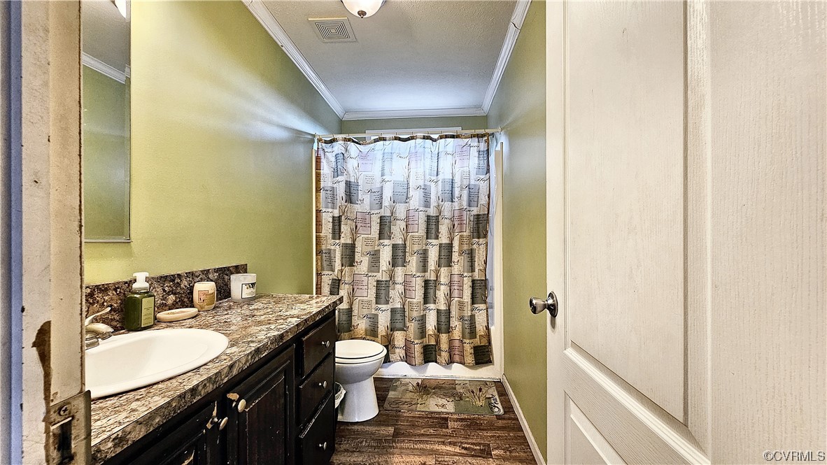 633 Taylors Mill Road Emporia, VA 23847 - Photo 10 of 14 a bathroom with a double vanity sink toilet and shower