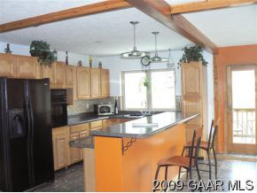 137 Raintree Road Verona, VA 24482 - Photo 8 of 12 a kitchen with stainless steel appliances granite countertop a sink refrigerator and microwave