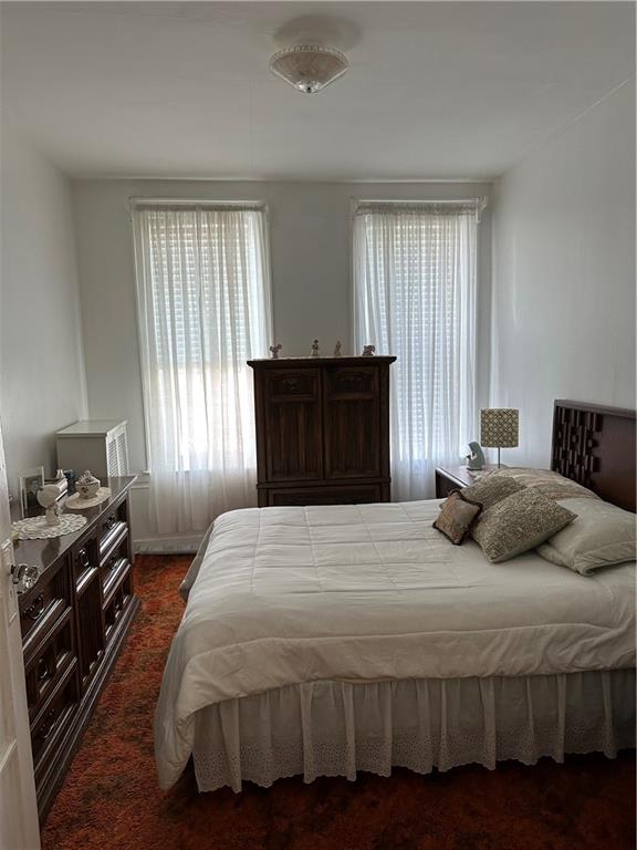 631 Bay Ridge Avenue Brooklyn, NY 11220 - Photo 2 of 9 a bedroom with a bed and a window