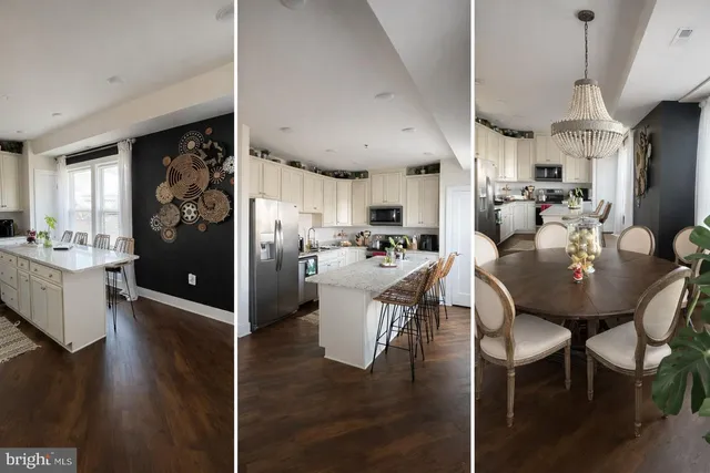 a kitchen with a dining table chairs refrigerator and sink