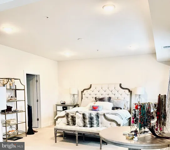 a very nice looking room with a large window and couch