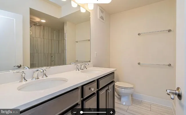 a bathroom with a sink toilet and vanity