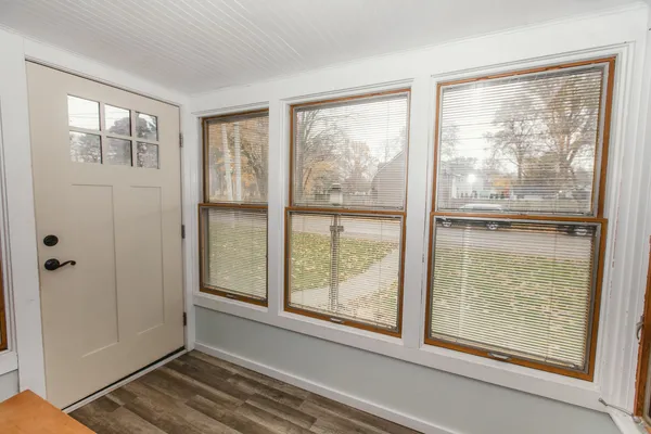 a view of wooden floor and a window