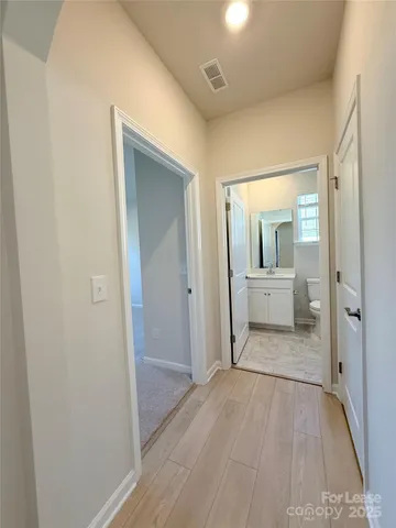 a view of a livingroom from a hallway