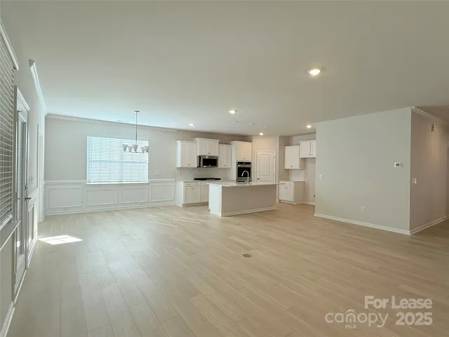 a view of kitchen with wooden floor