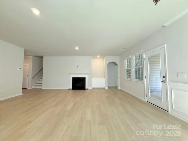 an empty room with fireplace
